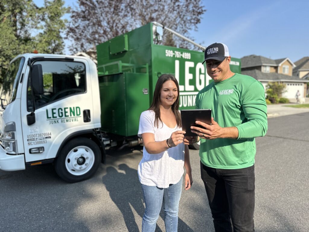 legend junk removal crew discussing service terms with client